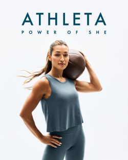A confident woman in athletic wear holds a basketball on her shoulder, standing under the words "ATHLETA POWER OF SHE" on a white background.